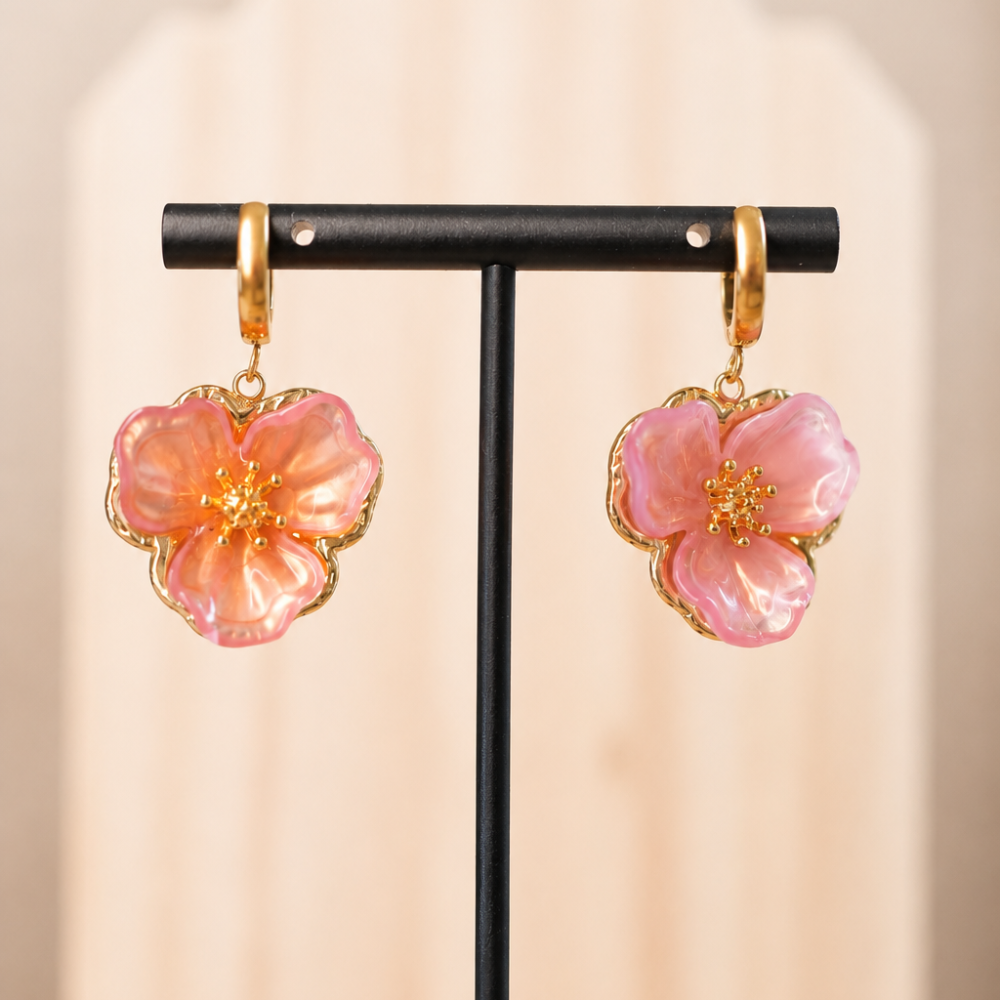 Gold hoop earrings with sculpted pink flower details, made from 304 stainless steel with an 18k gold PVD-coated finish. Part of the Curated Collection.