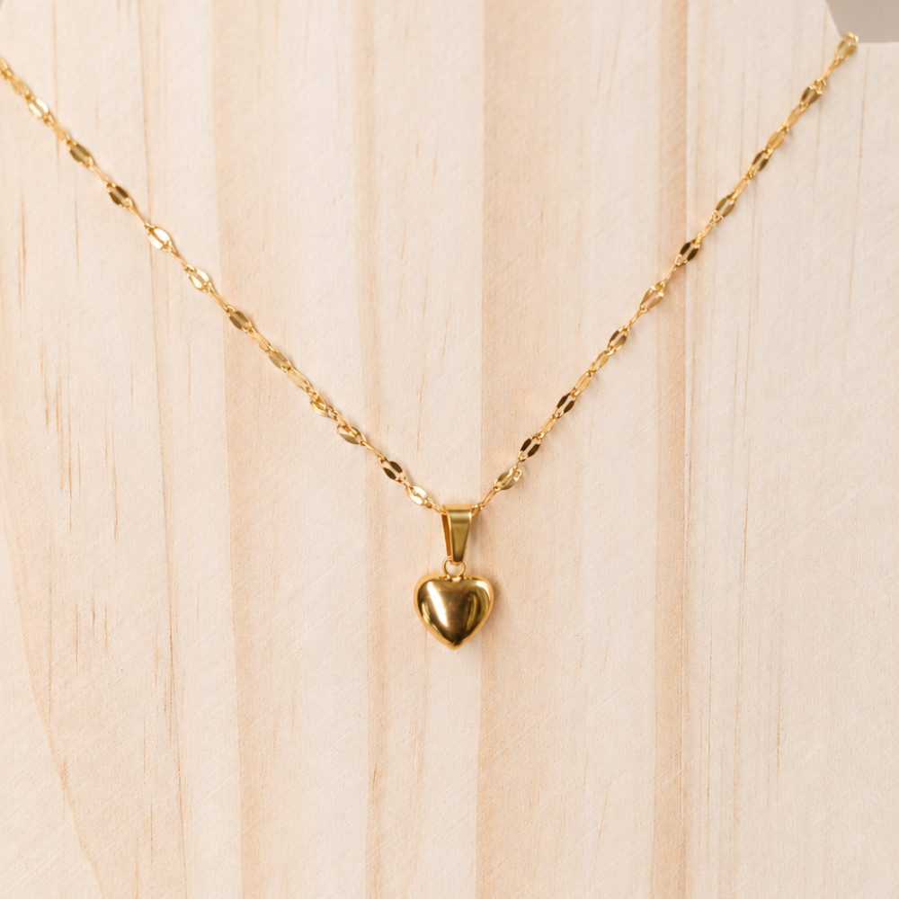 A delicate gold heart necklace made from 304 stainless steel with an 18k gold PVD-coated finish. A timeless everyday piece from the Curated Collection.