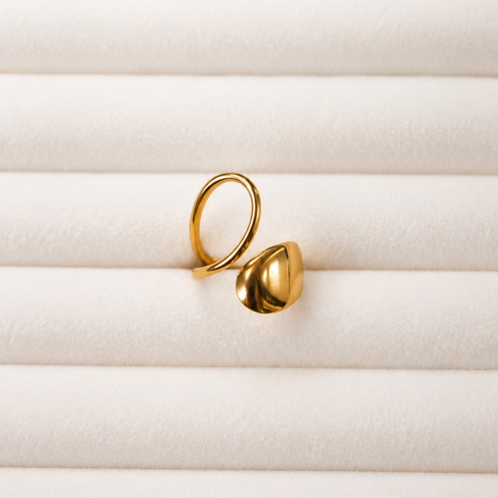 An adjustable sculptural gold ring made from 304 stainless steel with an 18k gold PVD-coated finish. Part of the Neréa Anthi Curated Collection.